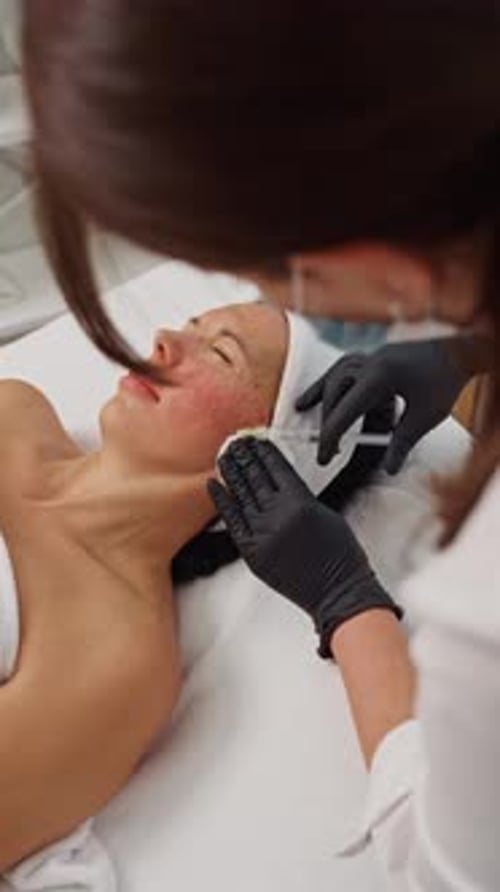 Woman Receiving Facial Injections in Medical Spa