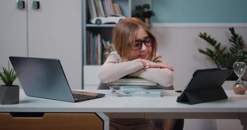 Tired Schoolgirl Sitting at Table Home. Preteen Girl Thinking About Solving School Lesson Exams