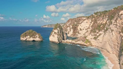 Sea Cliff Rock Face On Nusa Penida Coastline, Diamond Beach In Bali, Indonesia. Aerial Drone Shot