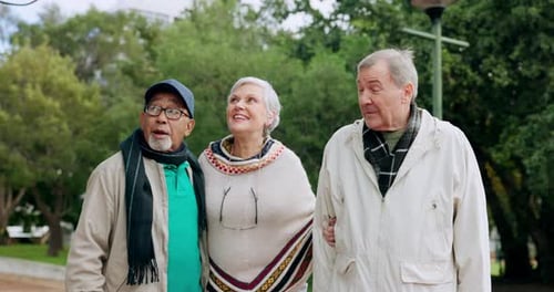 Nature, talking and senior friends walking in an outdoor park for fresh air and exercise