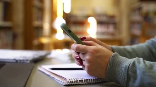 Closeup Hands of Mature Student Study in Classroom University Woman Using Laptop Cellphone for