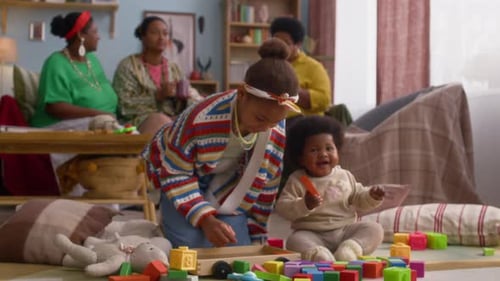 Child Building Colorful Blocks With Family