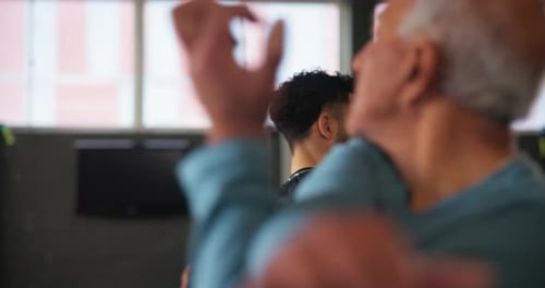 Personal trainer, stretching and senior people in gym for training, exercise