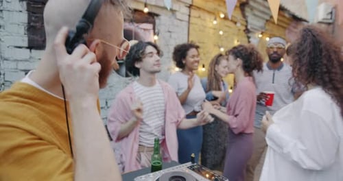 Friends Gather Dancing to Music from DJ