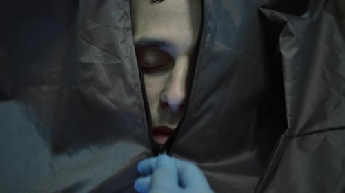 Close Up Of Body Bag Unzipping