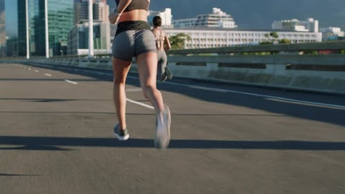 Fitness, city and women on road running for marathon training, cardio exercise