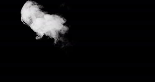 Smoke appears on the center left side of the frame and slowly drifts further to the left.