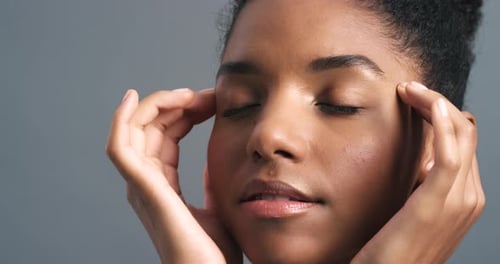 Woman Touches Her Face in Close Up