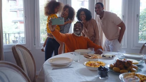 Happy Family and Friends Taking Selfie Together Indoors