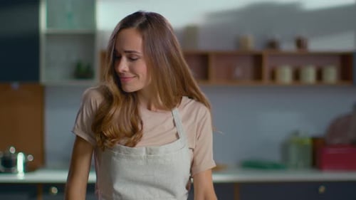 Close Up of Positive Woman Dancing on Modern Kitchen. Happy Housewife Cooking