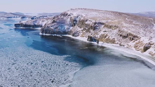 Coastal area of the Arctic Ocean in stunning showcasing icy waters, rugged shoreline, and vast