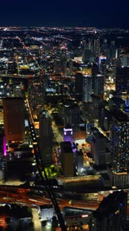 Panorama of a vibrant metropolis at night. Splendid view of Miami, Florida, USA from top