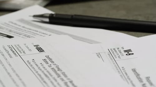 Tax Forms and Pen Close Up