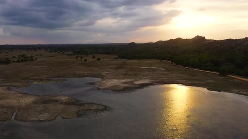 Aerial View of Lake and Rural Landscape at Sunset