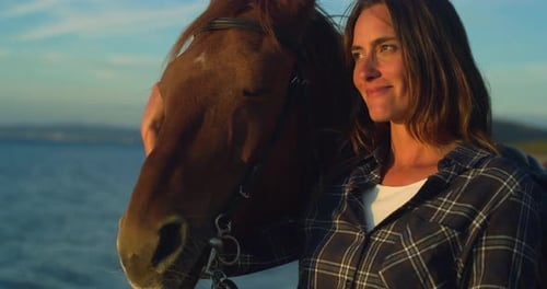 Close Up Portrait of a Happy Beautiful Woman With her Horse on Seaside Beach at Su