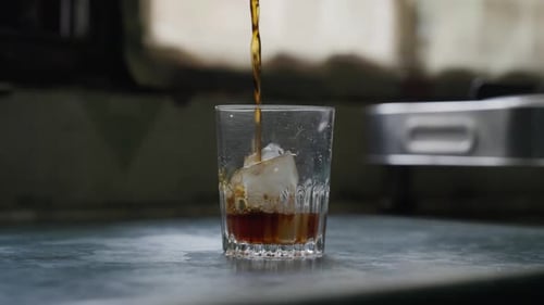 Cold Brew Coffee Being Poured Over Ice