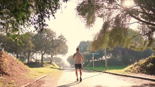 Male Jogger Running in Park