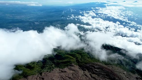 Panorama of flowing fog waves on mountain tropical rainforest,