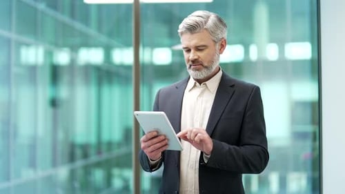 Man using tablet in modern office building