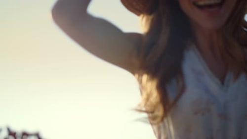 Smiling Woman Enjoying Sunlight and Nature Outdoors