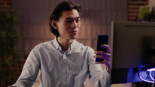 Young Adult on Phone Indoors