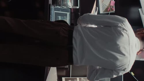 Detective Connecting Clues in Bright Office