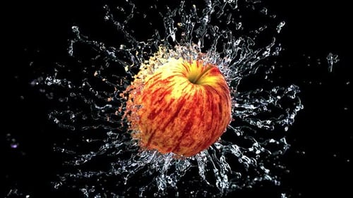 Red Apple Splashing in Clean Water
