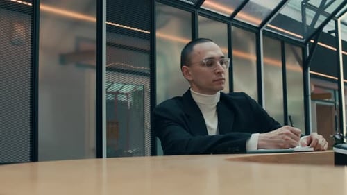 Eccentric Man Dancing in Middle of Paperwork in Office