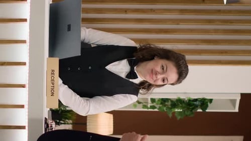 Vertical Video Hotel Concierge Verifying Passport Id