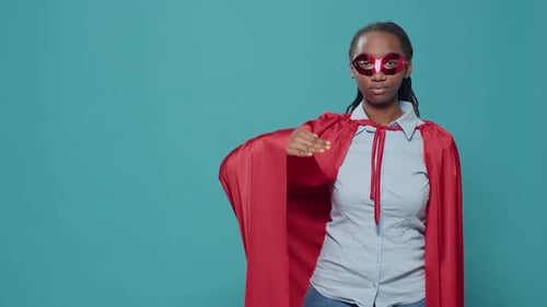 Portrait of Superhero with Cape and Red Mask