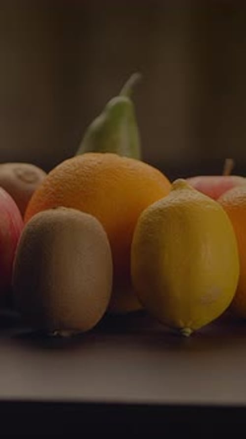 Fresh Fruit Still Life Displayed on Dark Surface