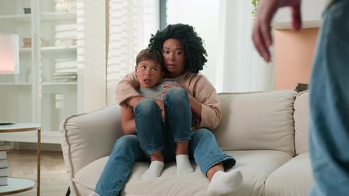 Mother and Child Cower in Fear