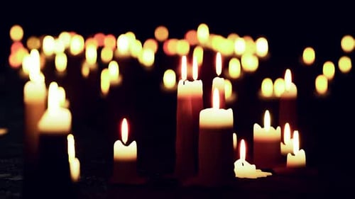 Flickering Candles with Warm Bokeh Lights Background