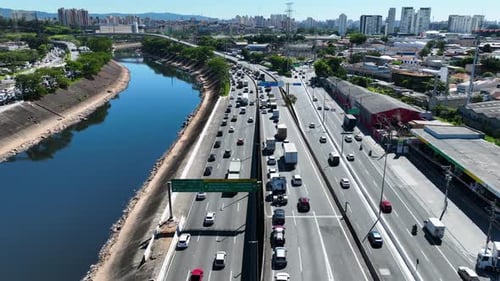 Cityscape of rush traffic jam at freeway road. Transportation scenery.