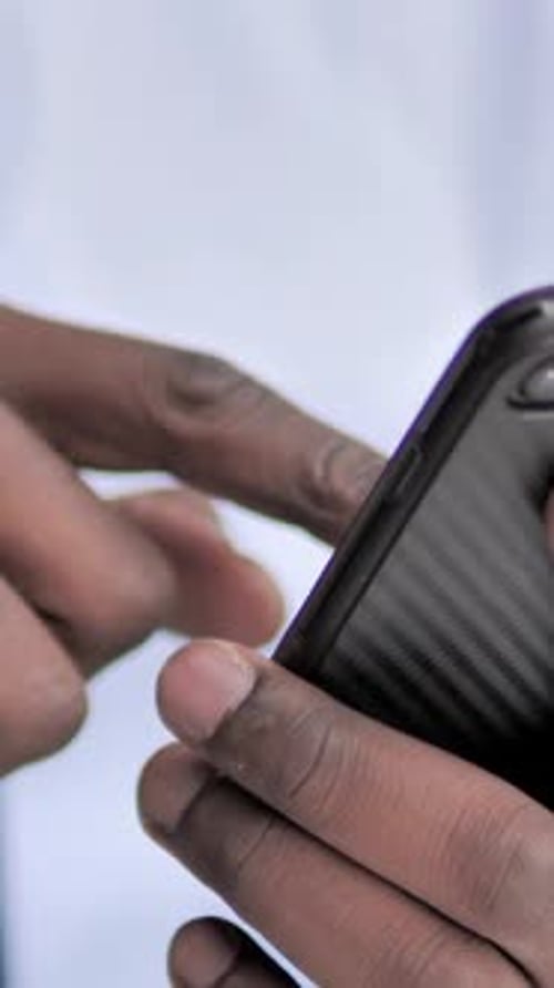 Hand Swiping Mobile Phone Screen Close Up