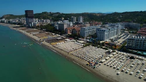 Hotels and resorts for booking with beach facilities on the Adriatic Sea, sandy shores, and pines in