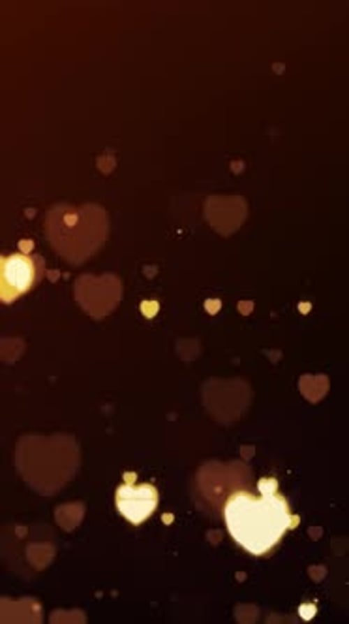 Corações dourados brilhantes e partículas girando