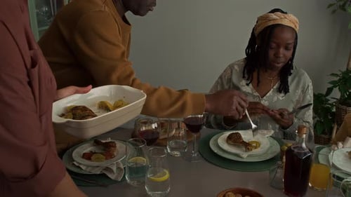Family Gathered Together Around the Dinner Table