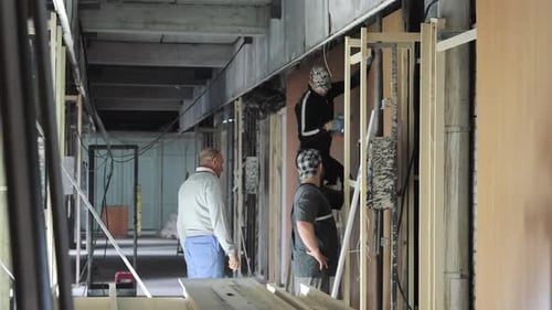 Construction Workers Building Inside a Construction Site
