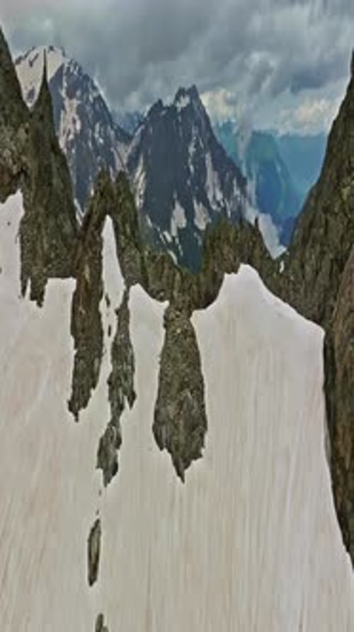 Ancient Snow Glacier Among High Mountains The Peaks of the Mountains are Covered with Snow