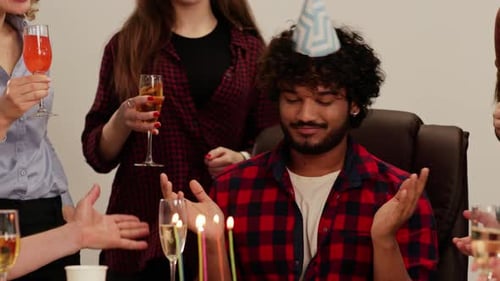 Young Adults Celebrate Birthday With Cake and Drinks