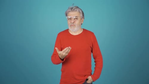 Unhappy man making negative gestures.
