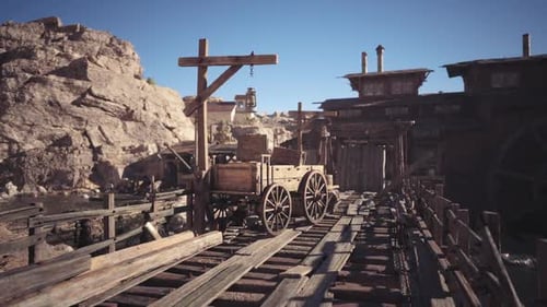 Desert Town with Wooden Wagon on Tracks in Daylight