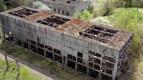 Aerial shot of abandoned old city. Empty damaged buildings exterior.