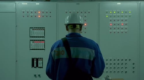 Electrical Engineer with Digital Tablet Running Checkup of Equipment at the Factory