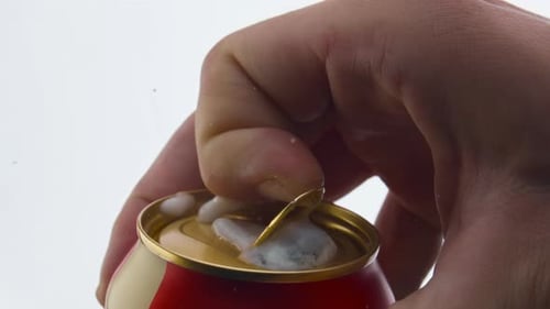 Soda Can Opening With Foam Overflow Close Up