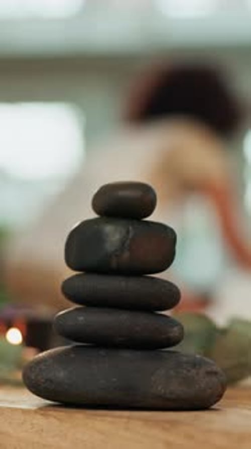 Hot stone, stack and spa at lodge for massage services, relax and holistic treatment for client