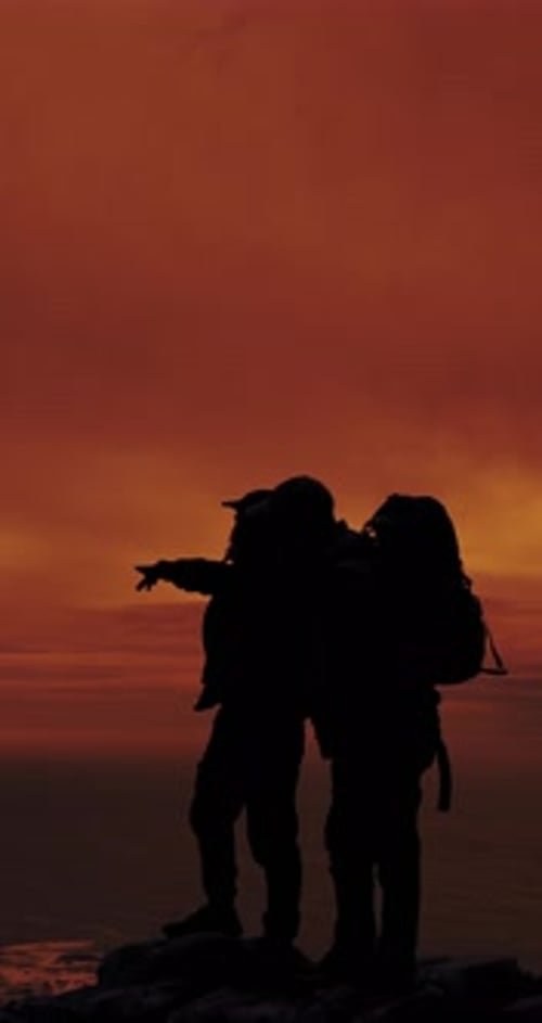 People, silhouette and point on mountain, hiking and direction for view