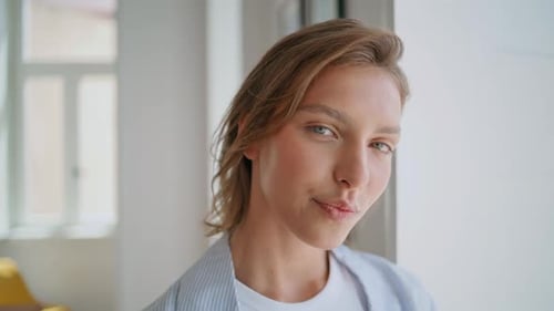 Woman Smiling and Posing Indoors