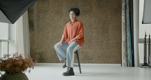 Portrait of an African American Woman sitting in a Photographic studio